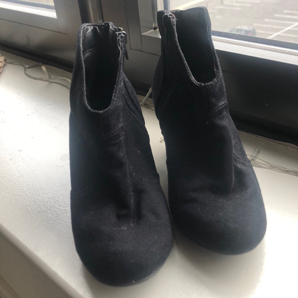 Women’s black booties.